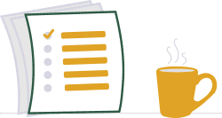A stack of help articles beside a cup of tea