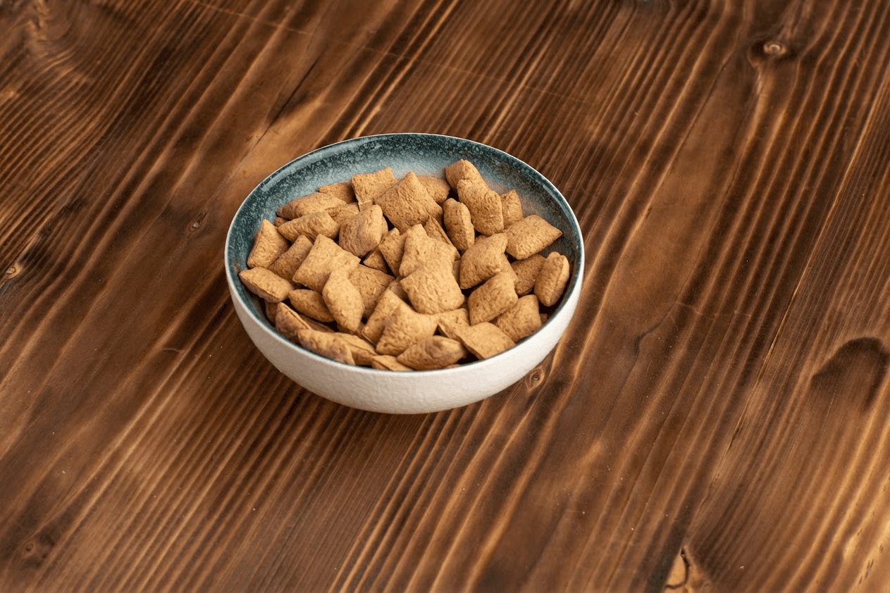 A bowl of Chewmandu yak cheese chews on a wooden table